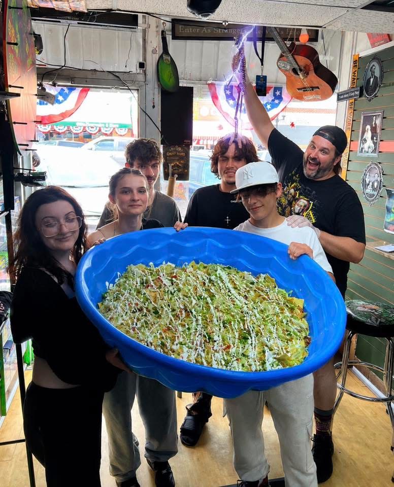 Crew holding a kiddie-pool walking taco at Walkers Branson