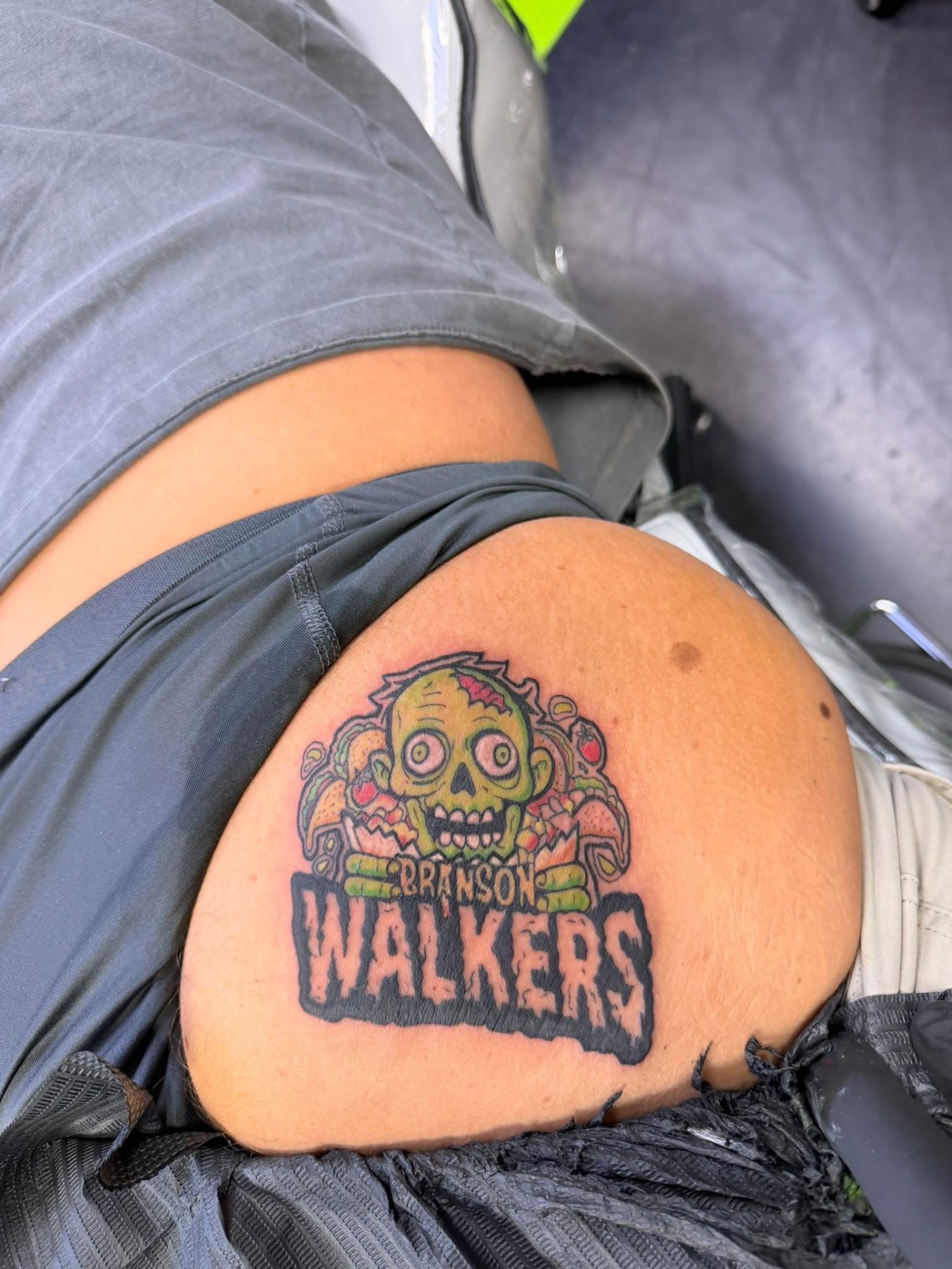 Branson Walkers logo tattooed on a customer's leg